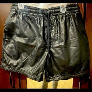 Cute perforated leatherette shorts.